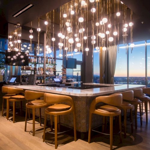 A stylish, dimly lit restaurant with warm string lights, long wooden tables, and a cozy, rustic dining ambiance.